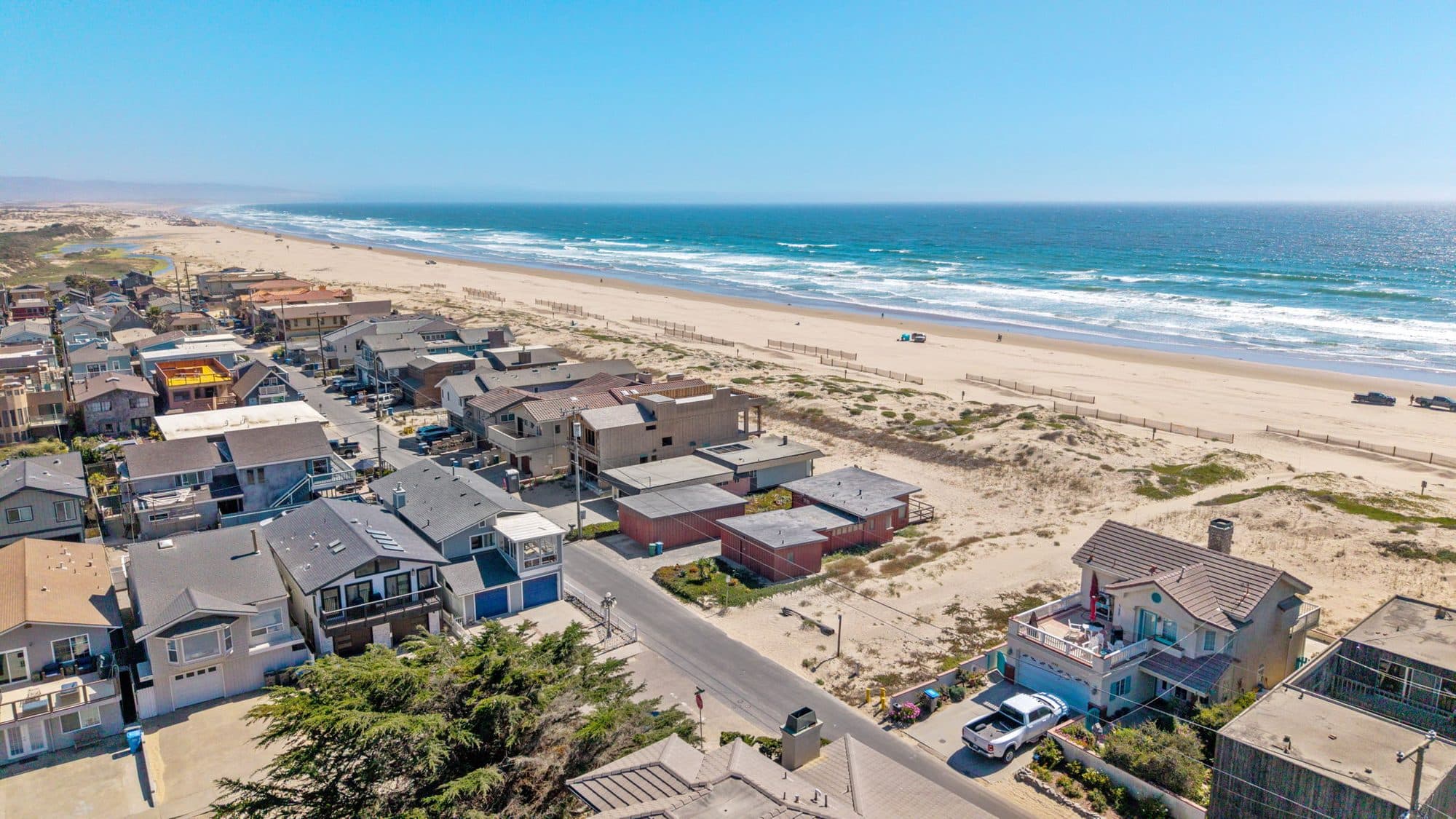 Aerial view of the Oceano Dunes shoreline and beach houses